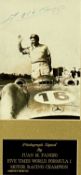 BLACK AND WHITE PHOTOGRAPH - JUAN M. FANGIO in Mercedes Benz racing car, signed in pen, 14 x 9.