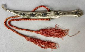 AN IRAQI WHITE METAL NIELLO DAGGER, 17cms curved blade, the scabbard inscribed 'To Professor E D