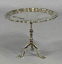 GEORGE V SILVER SWEET MEAT DISH, in the form of a tripod table with pie crust top, Birmingham