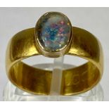 22CT GOLD BAND RING, set with an oval opal, size L-M, 6.4gms Provenance: private collection Ynys