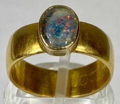 22CT GOLD BAND RING, set with an oval opal, size L-M, 6.4gms Provenance: private collection Ynys