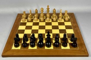 SET OF CHESSMEN, ebony and boxwood, 32 pieces with inlaid wooden board, 50cms² Provenance: private