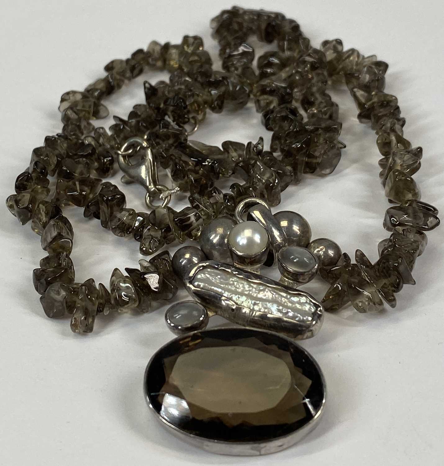 POLISHED AMBER NECKLACE and a smoky topaz and Biwa pearl silver necklace Provenance: private - Image 2 of 3