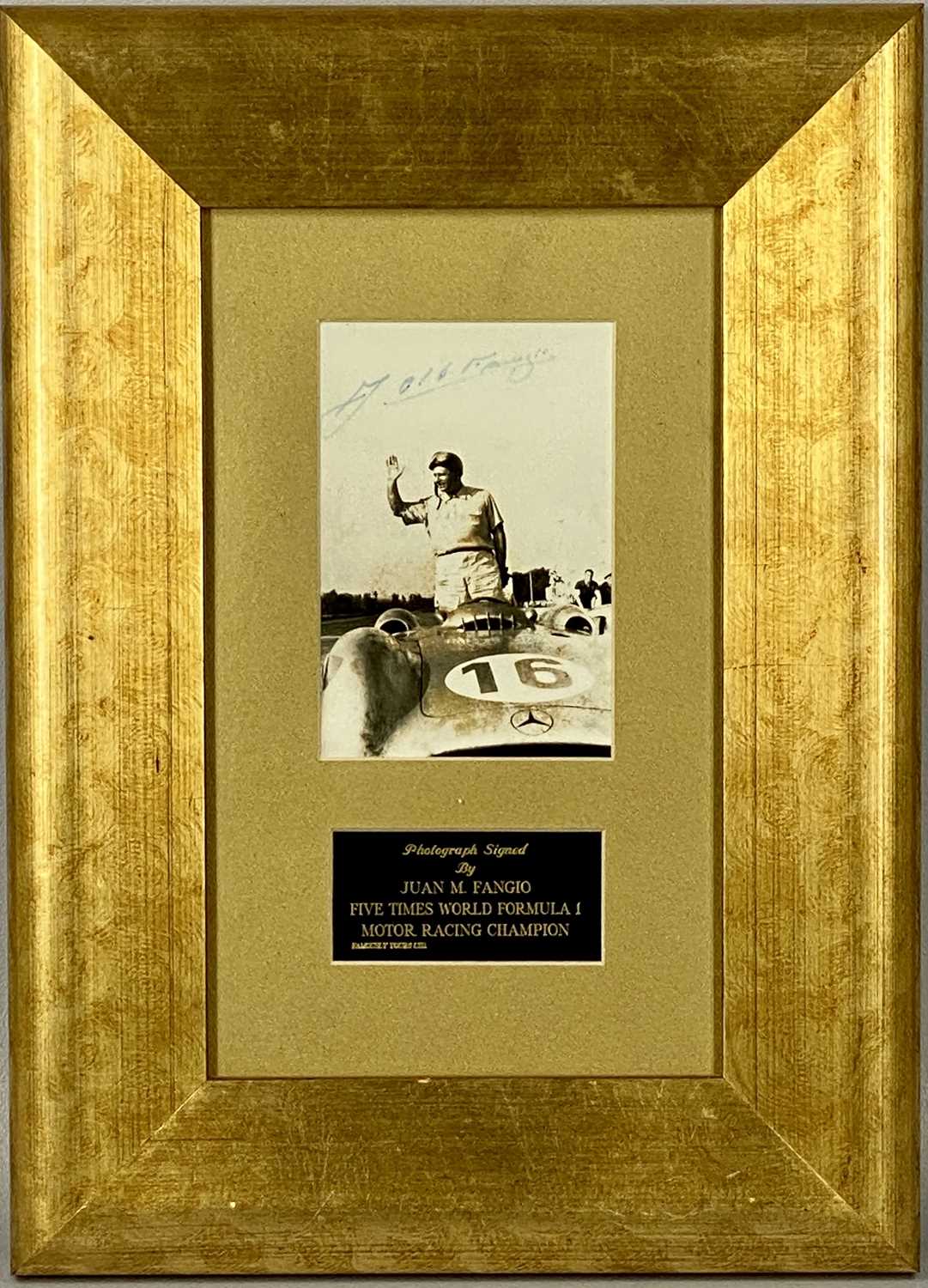 BLACK AND WHITE PHOTOGRAPH - JUAN M. FANGIO in Mercedes Benz racing car, signed in pen, 14 x 9. - Image 2 of 3