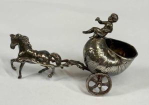 NOVELTY CONTINENTAL CAST SILVER SALT, modelled as cherub riding a snail shell chariot pulled by