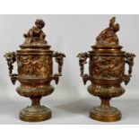 PAIR OF BRONZED CAST PEDESTAL URNS late 19th Century, in the manner of Clodion, twin-handles and