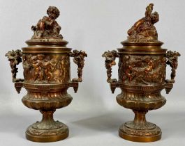 PAIR OF BRONZED CAST PEDESTAL URNS late 19th Century, in the manner of Clodion, twin-handles and