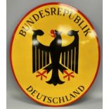 BUNDESREPUBLIK DEUTSCHLAND ENAMEL BORDER SIGN, convex oval format, black and red on yellow ground,