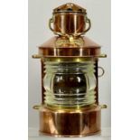 SHIP'S COPPER TOP LIGHT with brass mounts and swing handle, with burner, 32cms (h) Provenance: