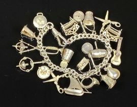SILVER CHARM BRACELET WITH 20 CHARMS, 24.6gms Provenance: private collection Conwy