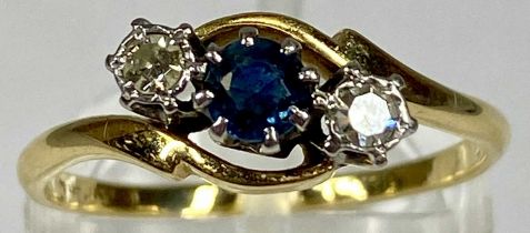 UNMARKED GOLD CROSSOVER RING set with a central sapphire and two diamonds, size O, 2.2gms