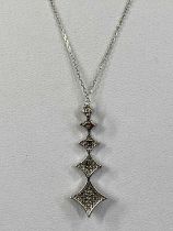9CT WHITE GOLD DIAMOND SET PENDANT, modelled as five graduated stars, approx. 0.25ct total with fine
