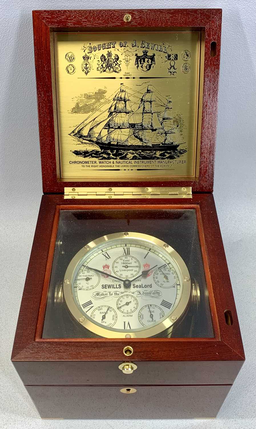 SEVILLS SEALORD FLAGSHIP SHIPS BELL CLOCK, with barometer, thermometer, hygrometer and tide guide,