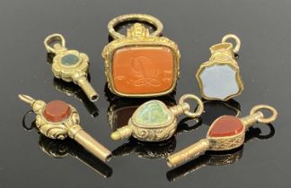 VARIOUS GOLD/GOLD TONE SEALS & WATCH KEYS, hardstone set Provenance: private collection