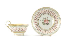 A SWANSEA PORCELAIN CUP & SAUCER circa 1818, decorated formally with cornflower heads, centred roses