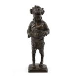 A SCOTTISH BRONZE SCULPTURE OF A YOUNG BOY AFFIXING A MILITARY BELT TO WAIST the boy modelled with