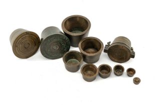 FOUR SETS BRONZE APOTHECARY'S BUCKET OR 'PILE DE CHARLEMAGNE' WEIGHTS, included William IV set,