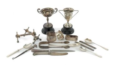 ASSORTED  SILVER FLATWARE & COLLECTABLES, including two small trophy cups (engraved) on ebonised