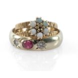 TWO GOLD RINGS comprising 9ct gold opal ring, and a 9ct gold three-stone diamond and ruby cabochon