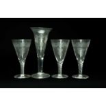 FOUR LARGE ENGRAVED GLASS GOBLETS, comprising set 3 with airtwist stems and fruiting vine