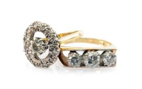 TWO 18CT GOLD DIAMOND RINGS, comprising a three stone ring, 0.5cts overall approx., and a halo ring,