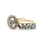 TWO 18CT GOLD DIAMOND RINGS, comprising a three stone ring, 0.5cts overall approx., and a halo ring,