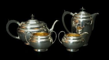 GEORGE VI SILVER FOUR PIECE TEASET, oval form, cream jug and sucrier with gilt interiors, Chester