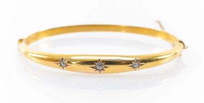 15CT GOLD DIAMOND HINGED BANGLE, three 'gypsy' set stones, 6.9gms Provenance: private collection