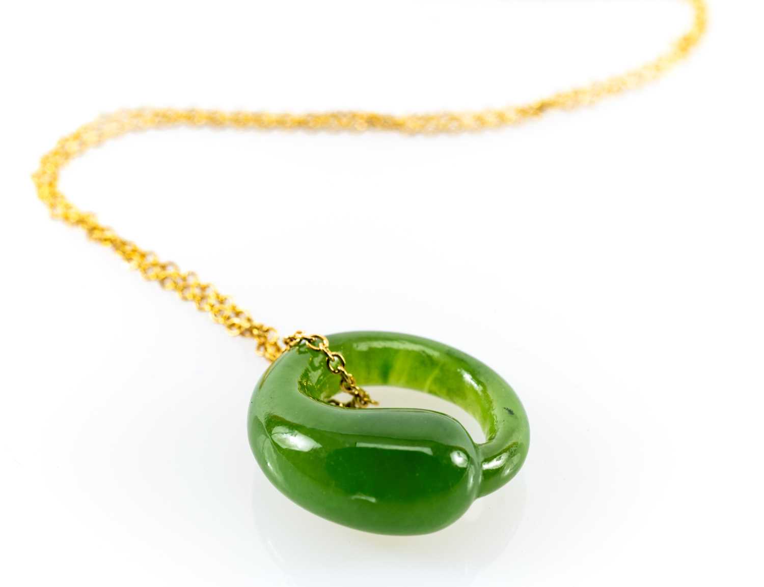 TIFFANY 'ETERNAL CIRCLE' JADE PENDANT, by Elsa Peretti, on 18ct gold fine chain, 3.6gms