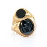 TWO GOLD RINGS comprising 9ct gold believed hematite intaglio ring, together with a 9ct gold onyx