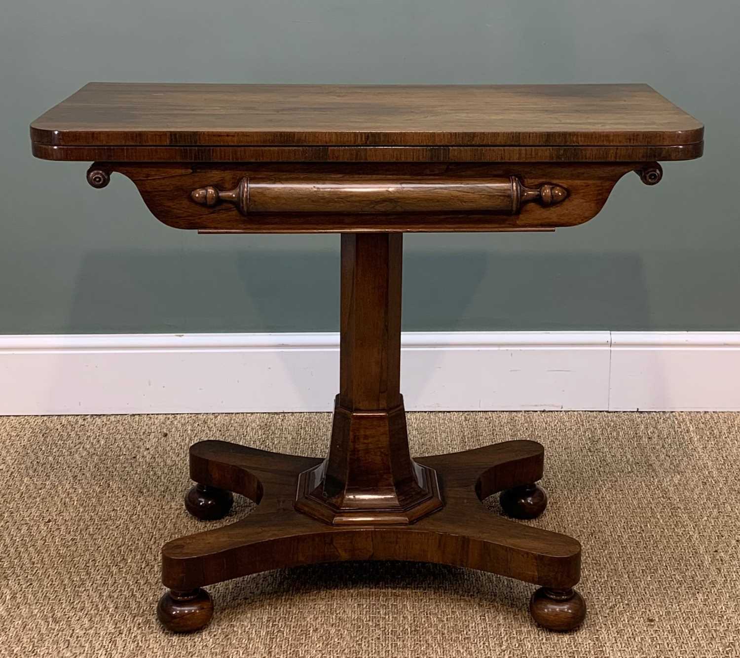 WILLIAM IV ROSEWOOD CARD TABLE, green baize interior, tapering octagonal coloumn over concave