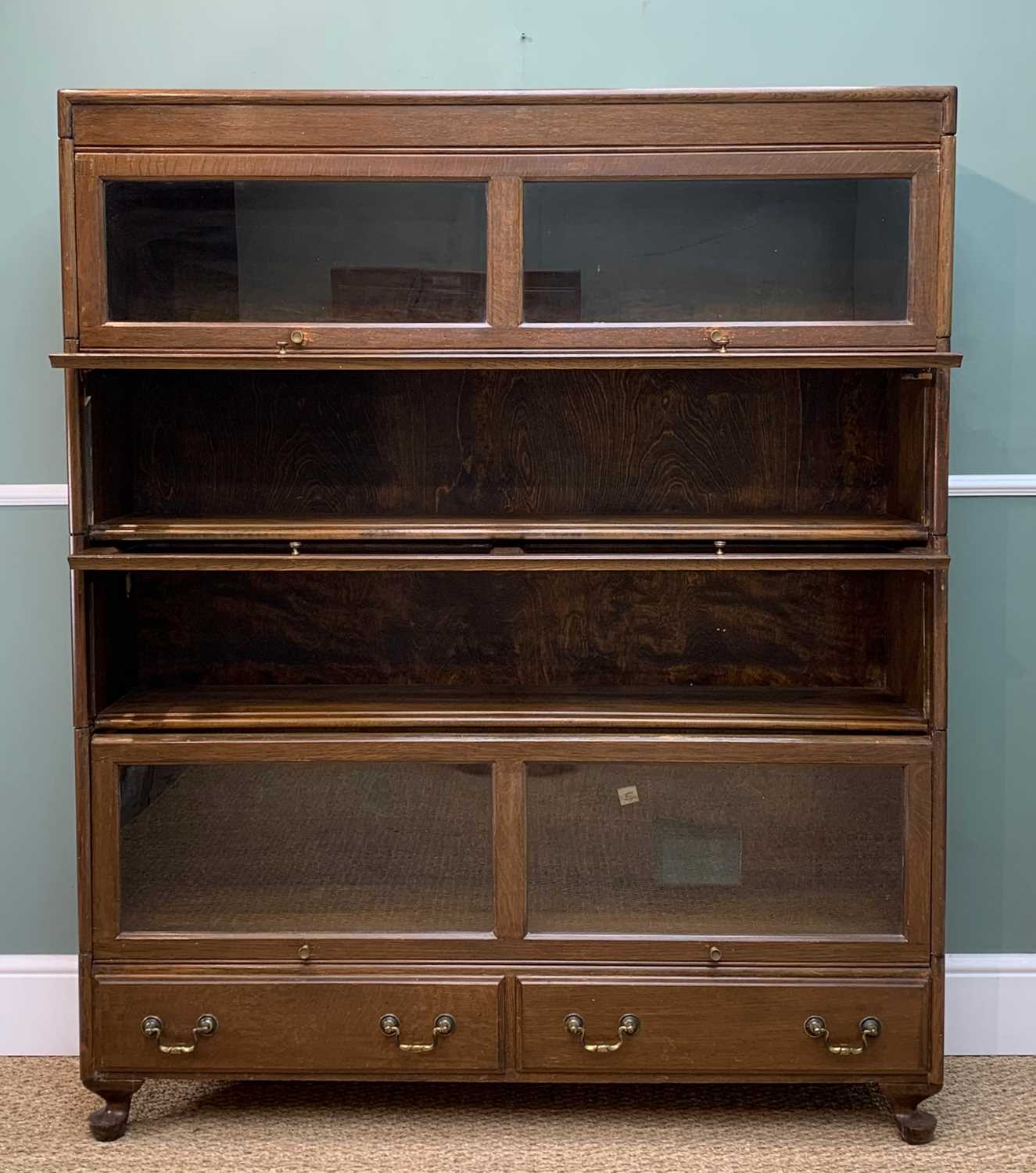 EARLY 20TH C. STAINED OAK WERNICKE STYLE BOOKCASE, four shelves with up-and-over glazed doors over
