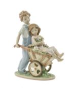 LLADRO PORCELAIN FIGURINE, The Prettiest of All, 6850, children with wheelbarrow, 25cms (h)