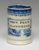 SWANSEA 'NAMED' BLUE & WHITE TANKARD printed in black with cartouche 'John Price Llanwrtyd' reserved