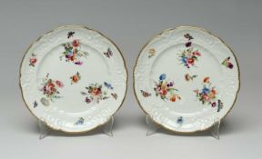 PAIR OF NANTGARW PORCELAIN DESSERT PLATES circa 1815-1821, moulded c-scroll borders, three sprays of