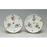 PAIR OF NANTGARW PORCELAIN DESSERT PLATES circa 1815-1821, moulded c-scroll borders, three sprays of