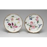 PAIR OF NANTGARW PORCELAIN DESSERT PLATES circa 1813-1820, each painted with full blown roses and