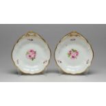 PAIR OF NANTGARW PORCELAIN FAN-HANDLED DESSERT DISHES circa 1813-1820, centres painted with sprays