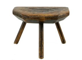 WELSH ASH MILKING STOOL, 19th Century, probably Carmarthenshire, the thick chamfered seat with