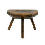 WELSH ASH MILKING STOOL, 19th Century, probably Carmarthenshire, the thick chamfered seat with