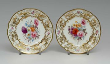 PAIR OF MATCHING NANTGARW PORCELAIN PLATES circa 1817-1820, with large central floral spray to the