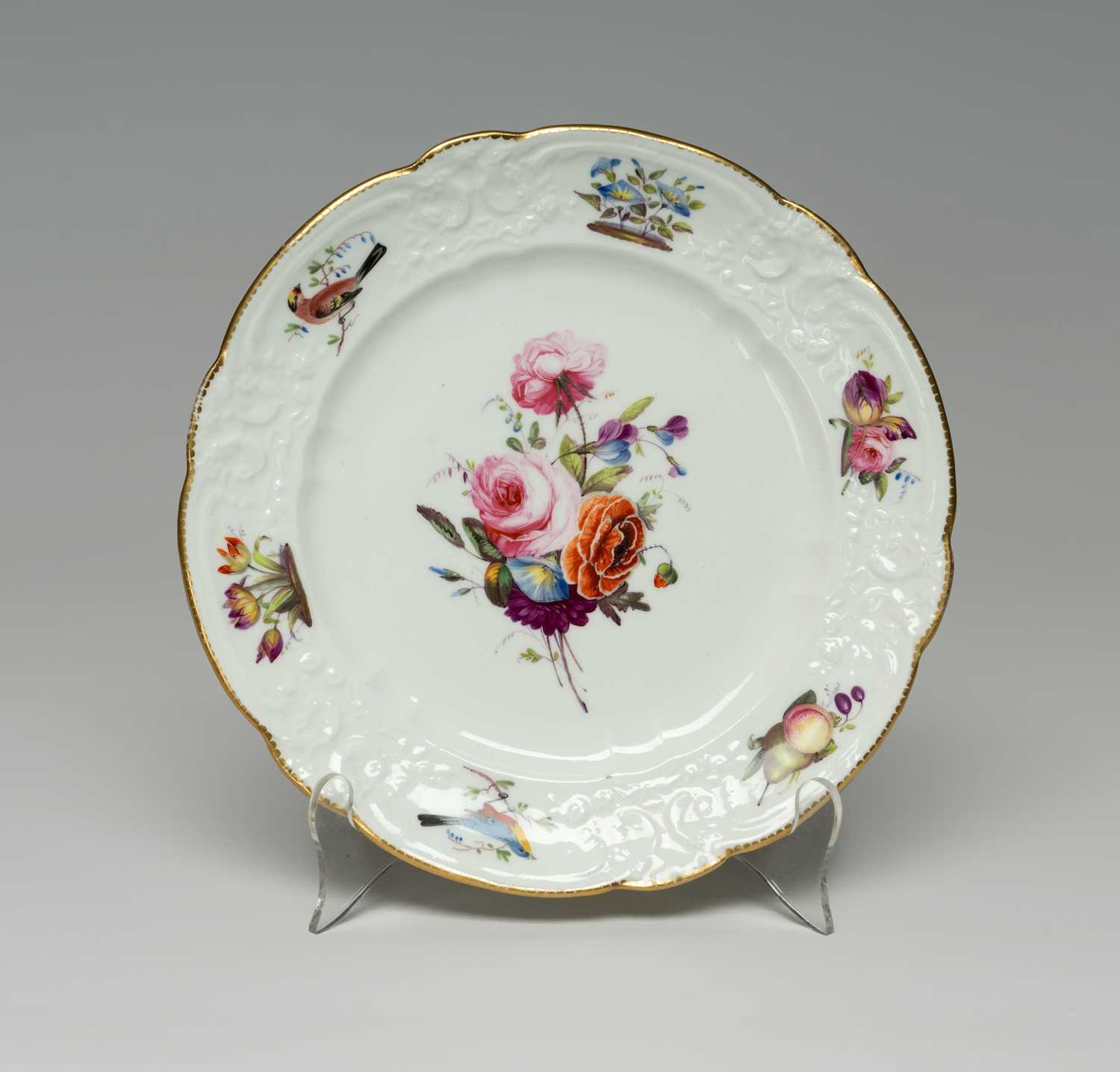 NANTGARW PORCELAIN PLATE FROM THE BRACE SERVICE circa 1818-1820, having C-scroll moulded border,