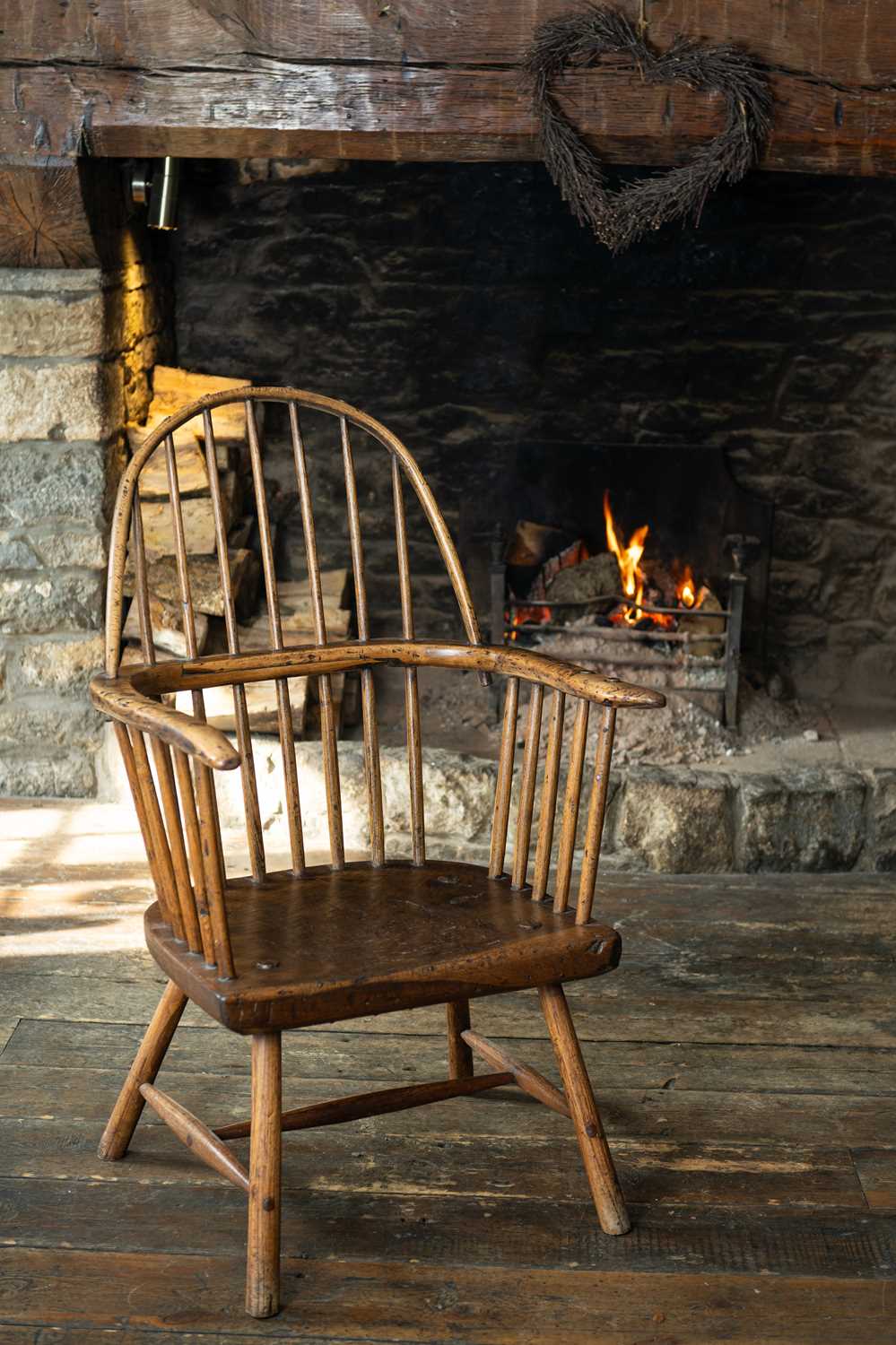 WELSH ELM & ASH STICK BACK ARMCHAIR, c.1800, probably Carmarthenshire, the arched back above seven