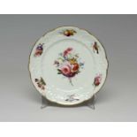 NANTGARW PORCELAIN PLATE FROM THE BRACE SERVICE circa 1818-1820, having C-scroll moulded border,