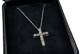 TIFFANY & CO PLATINUM DIAMOND CROSS PENDANT, set with eleven round brilliant cut diamonds, on