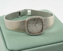 18CT WHITE GOLD ZENITH LADIES' BRACELET WATCH, diamond bezel, silvered dial with Roman numerals at