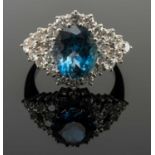 18CT WHITE GOLD AQUAMARINE & DIAMOND CLUSTER RING, the central aquamarine measuring 3.3cts