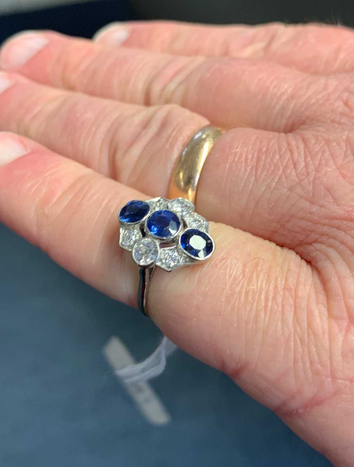 WHITE METAL SAPPHIRE & DIAMOND CLUSTER RING, the three vertical sapphires complimented by six old - Image 2 of 2