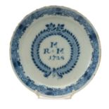 GEORGE II ENGLISH DELFT MARRIAGE PLATE, dated 1728, centre painted with initials 'R+M M' within