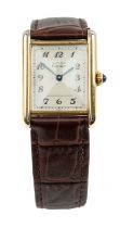 SILVER GILT MUST DE CARTIER LADIES' 'TANK' WRISTWATCH, stepped cream dial with Arabic numerals,